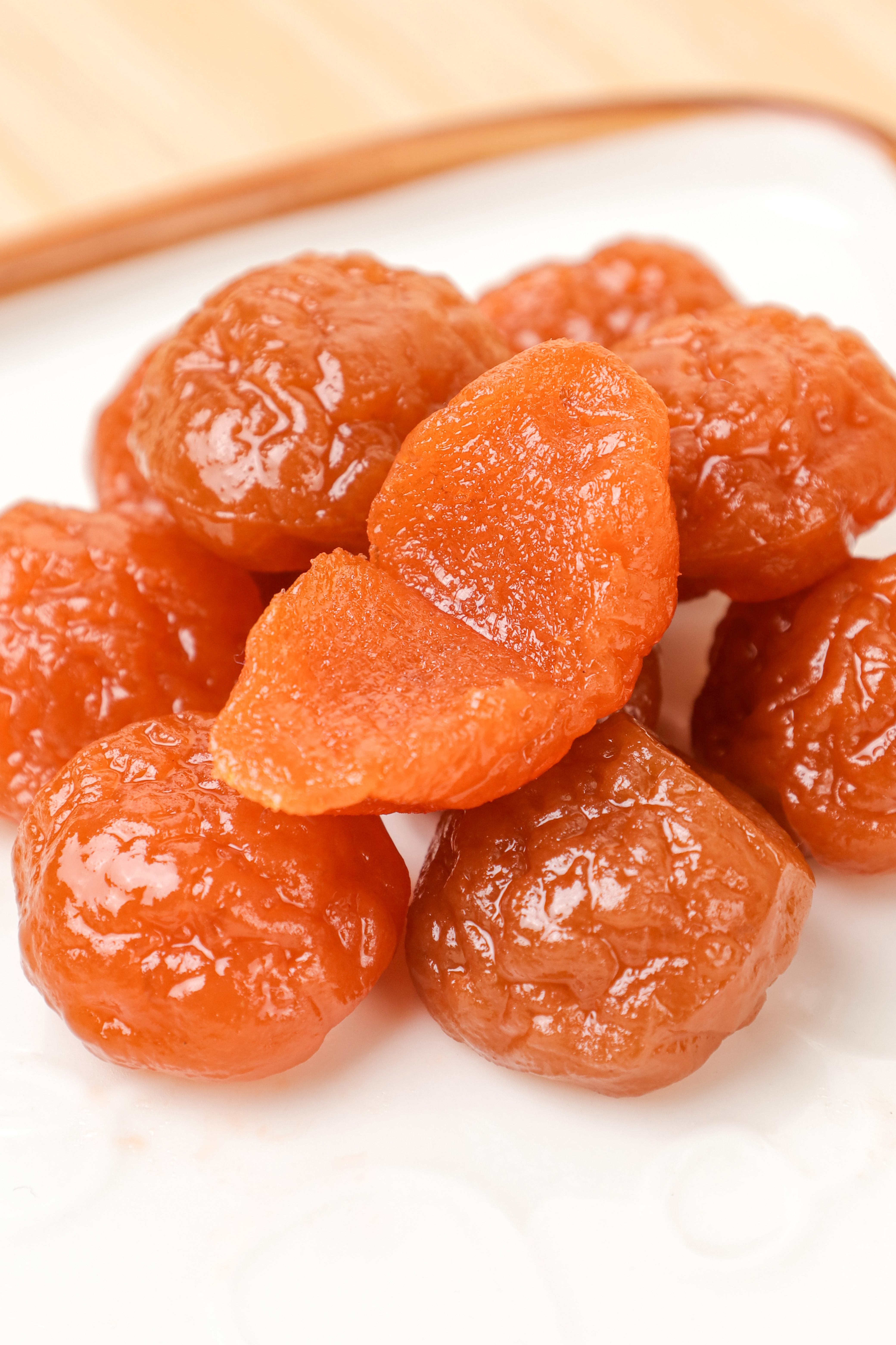 AGOLYN Premium Dried Plum Candy - Sweet and Tangy Varieties on White Plate